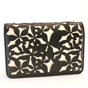 Bebe Black and gold women's clutch/crossbody Cutwork Die-cut Denise Small Dome.